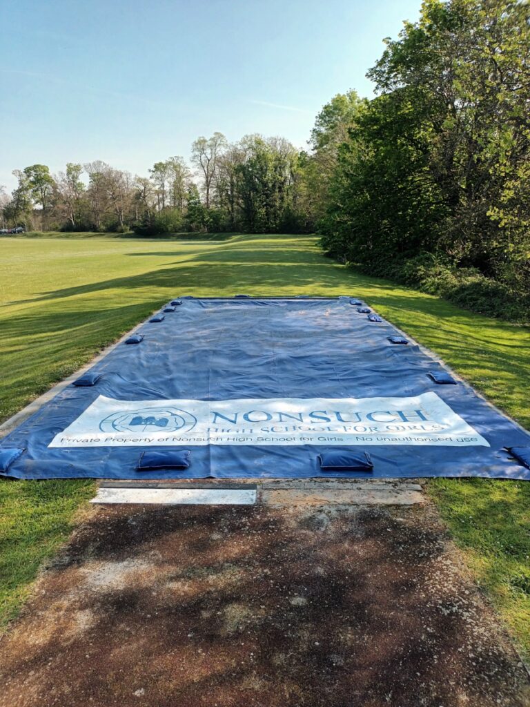 Branded long jump pit cover
