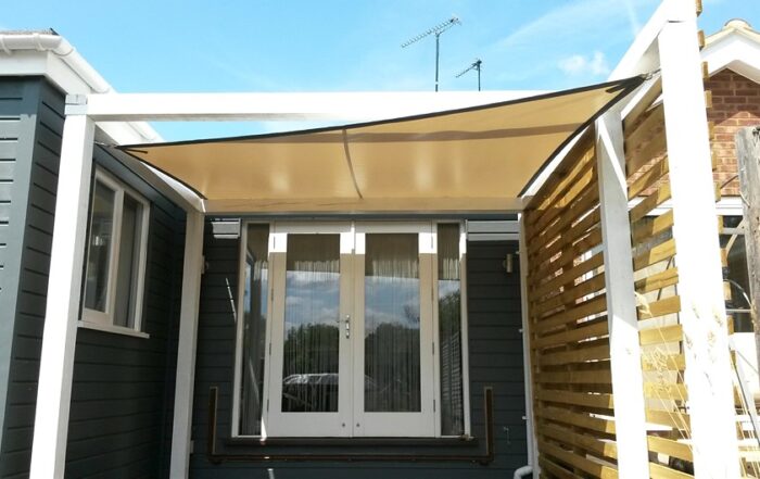Tensioned outdoor shade sail