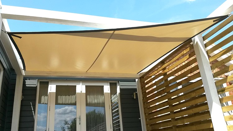 Tensioned waterproof shade sail