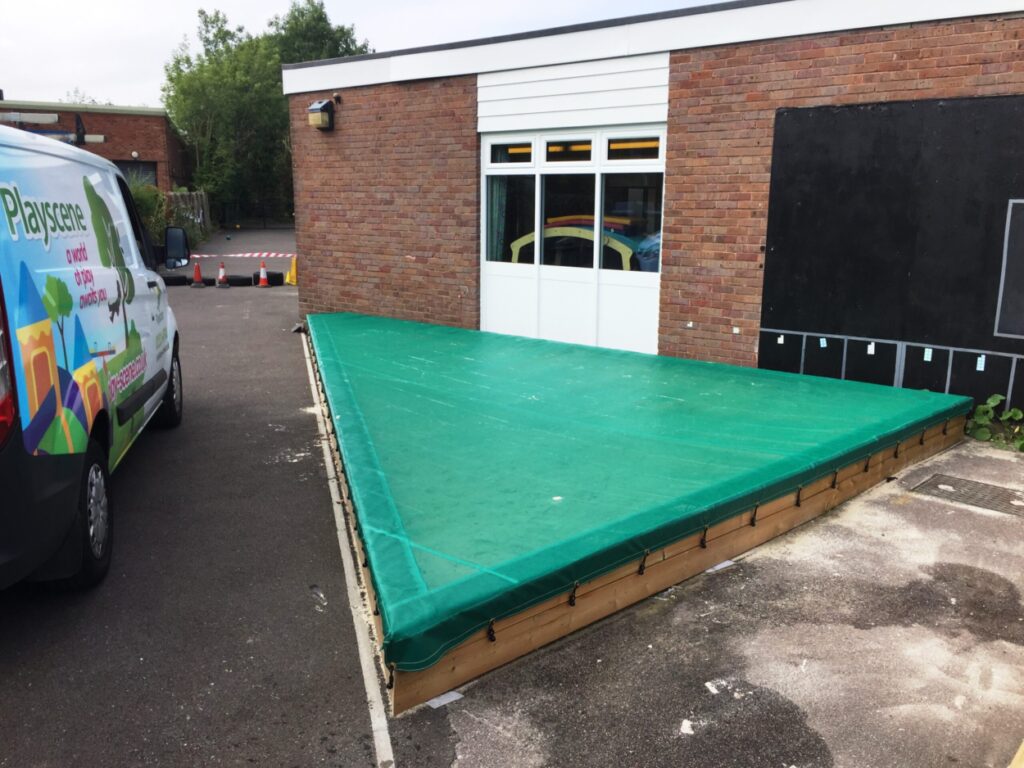 Triangular green netting sandpit cover