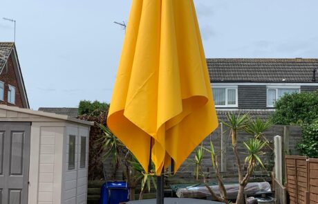 Folded yellow parasol 2