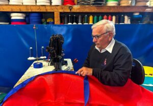 Frank Brackenbury sewing tarpaulin